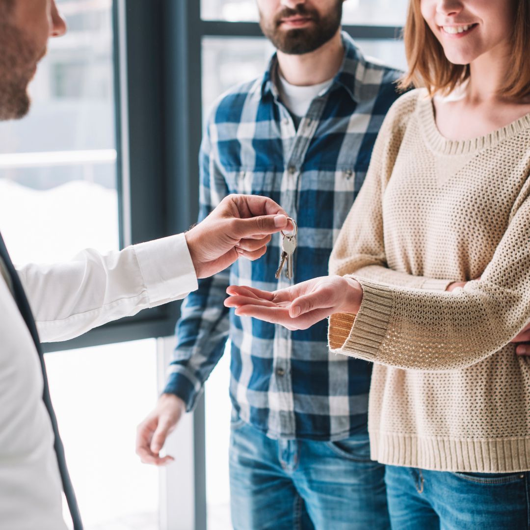 Image of a couple accepting keys