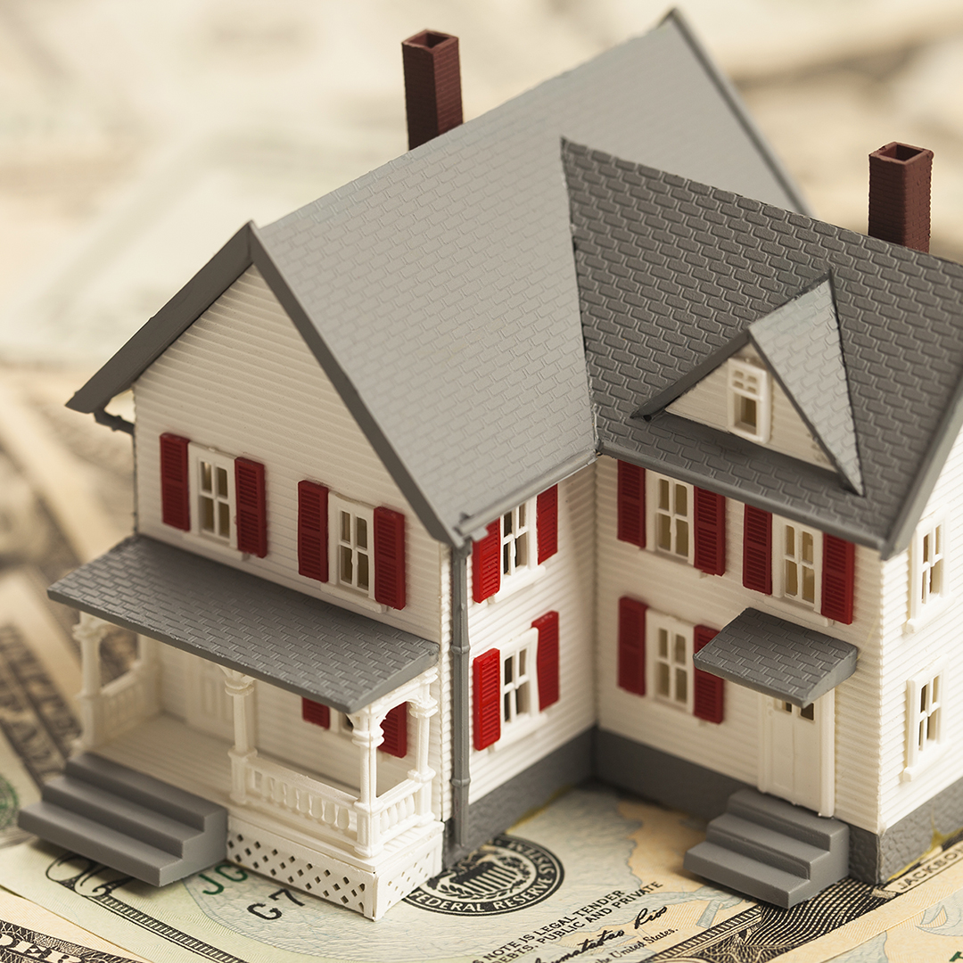 Image of a model house on cash