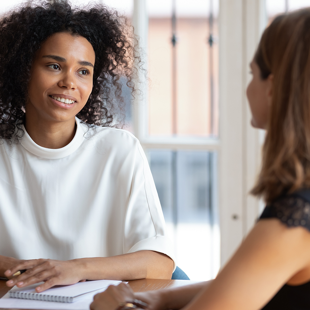 Image of two women talking