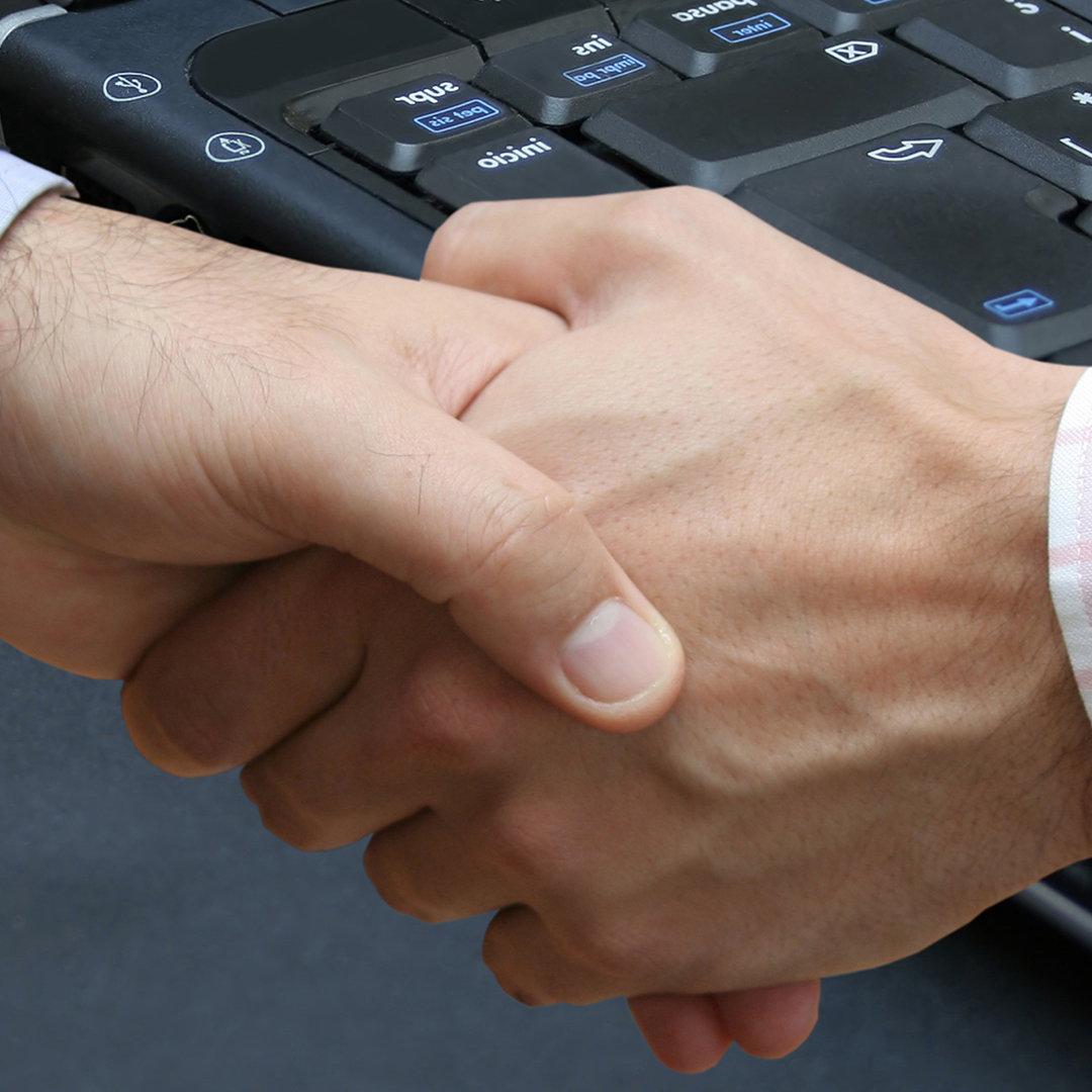 Image of two men shaking hands