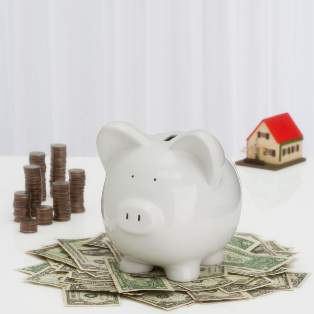 house, piggybank and cash
